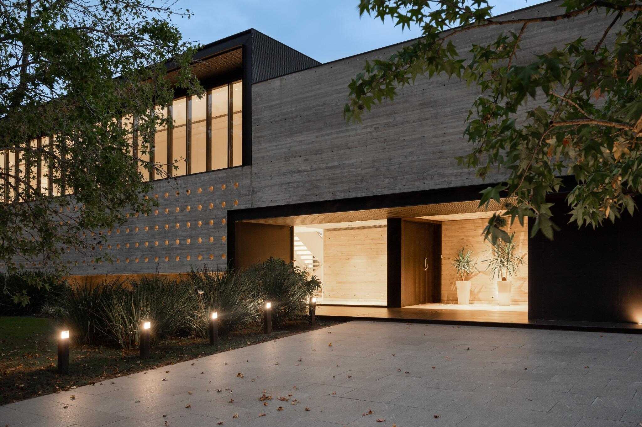 Pacheco House Front Driveway Evening Evening glow highlights the driveway and main entrance of Pacheco House.