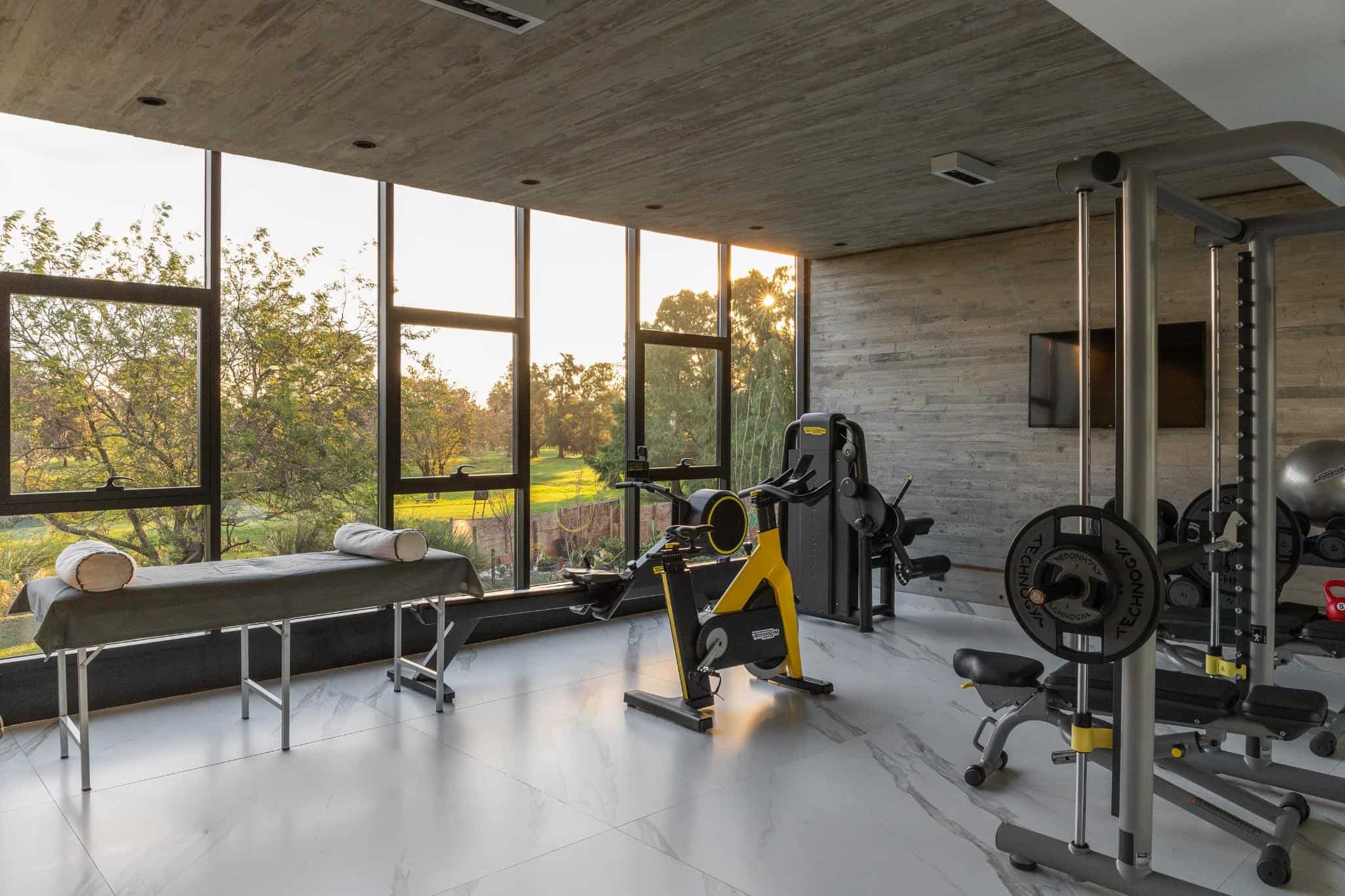 Pacheco House Gym Fitness Area Fitness and exercise space in Pacheco House with large windows and natural light.