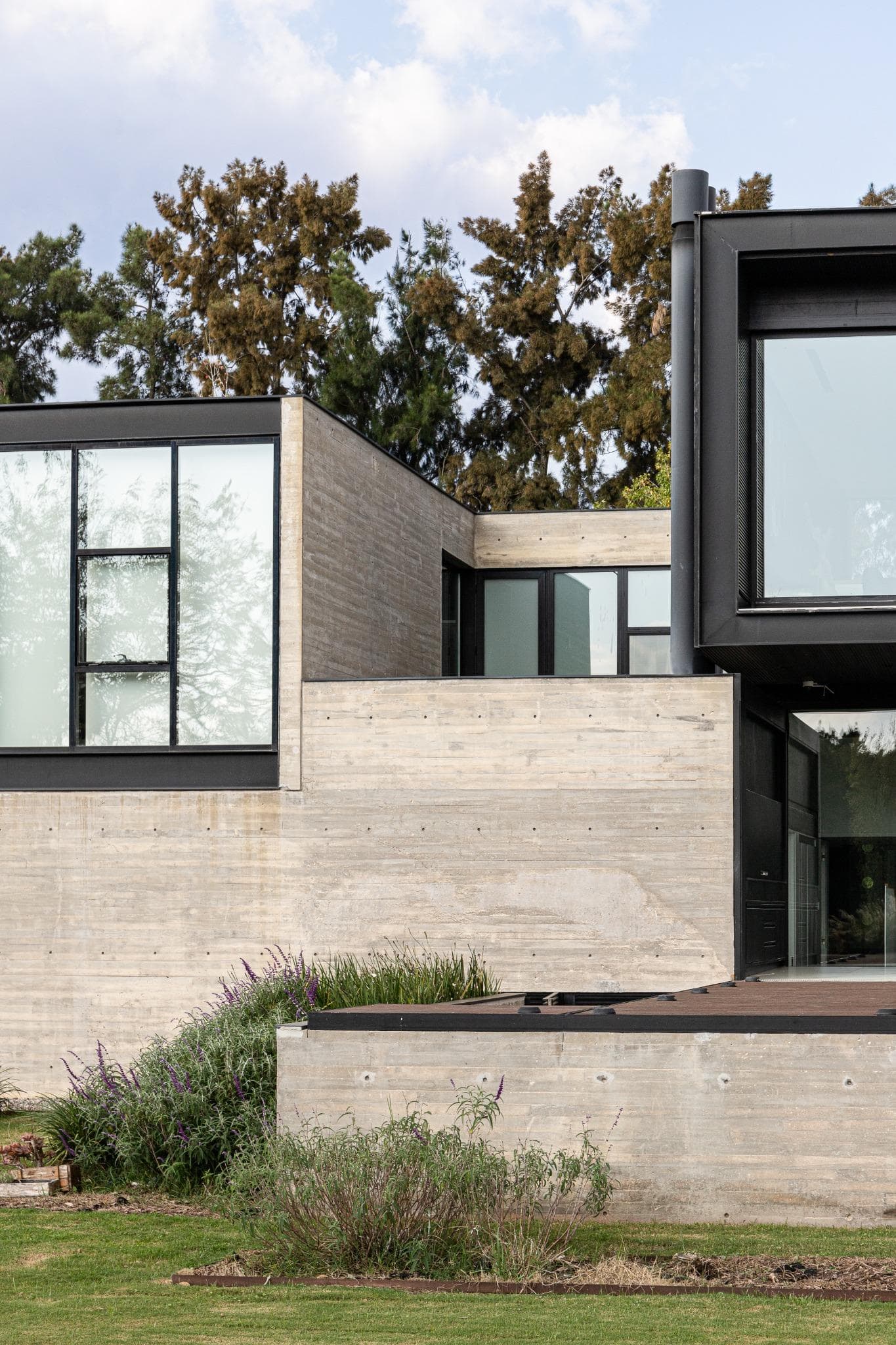 Pacheco House Side Entry Massive Walls Massive concrete entry walls form a sculptural side approach to Pacheco House.