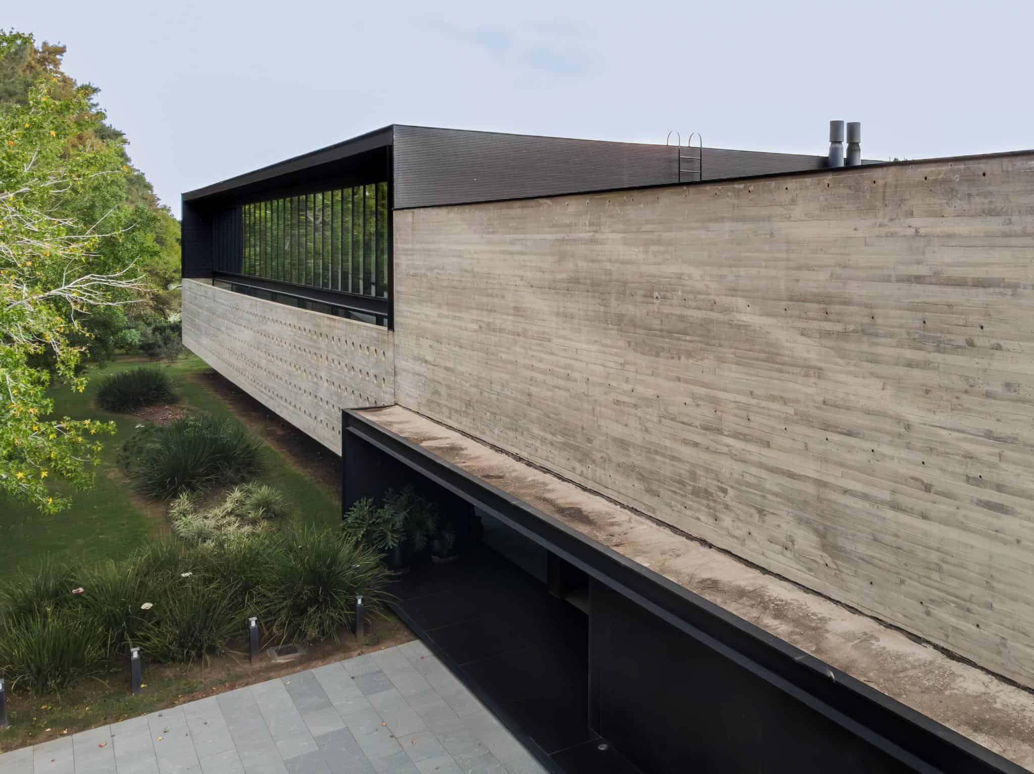 Pacheco House Upper Volume Overhang Aerial view of the cantilevered upper volume at Pacheco House, designed by A4estudio.