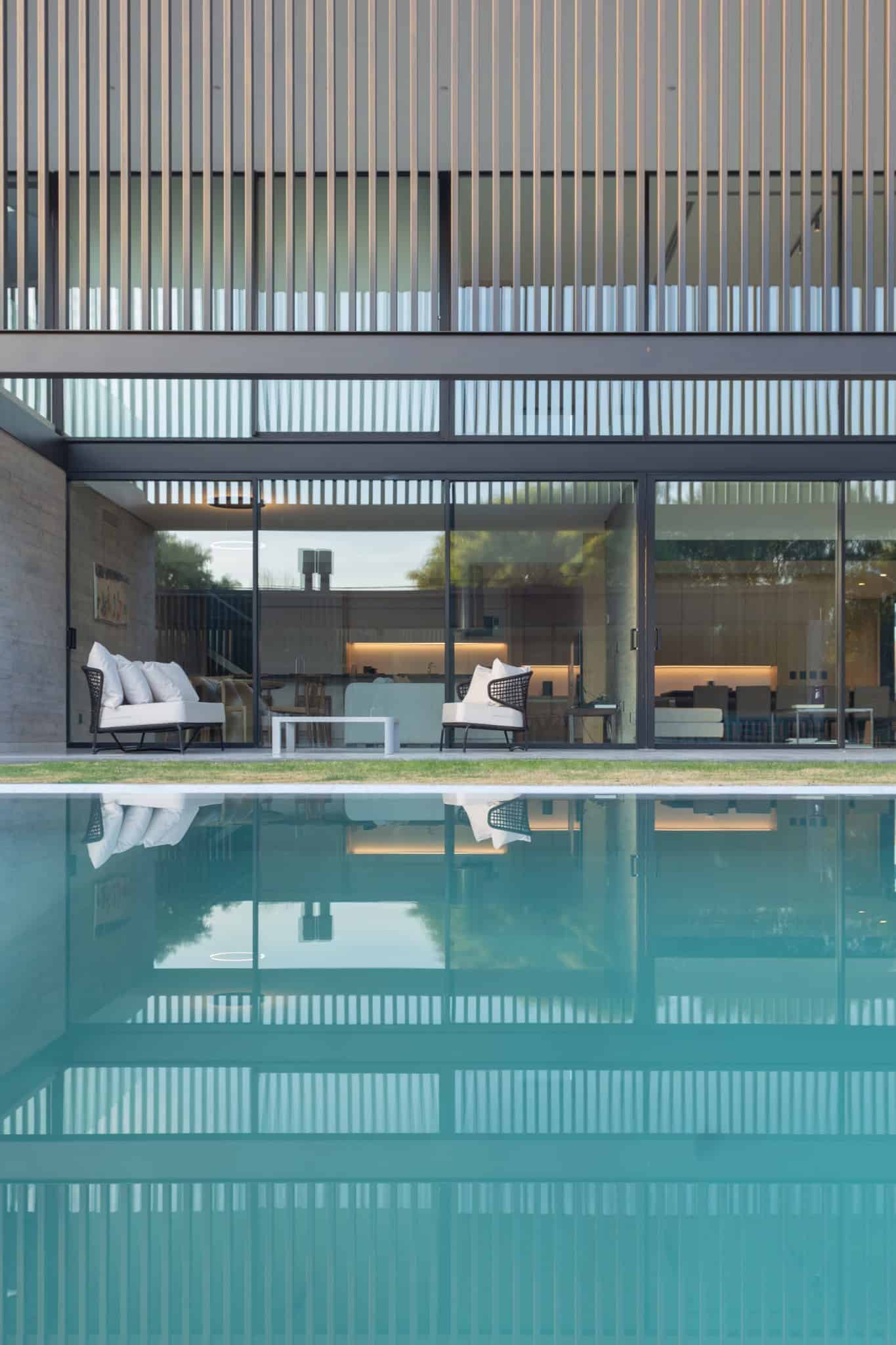 Symmetrical Facade Reflecting Pool A4Estudio Casa EE by A4estudio - Symmetrical facade reflecting pool a4estudio