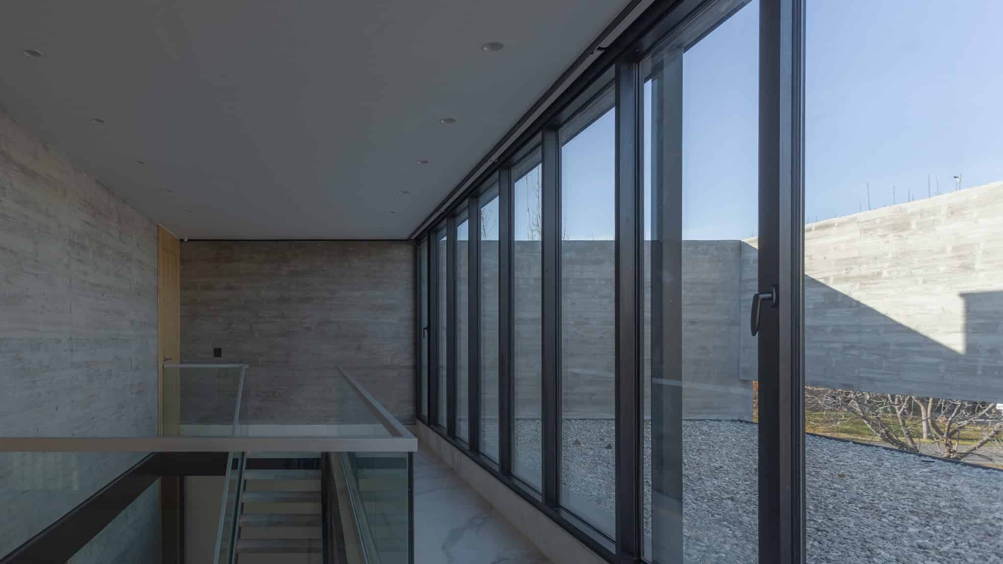 Upstairs Corridor Window Wall A4Estudio Casa EE by A4estudio - Upstairs corridor window wall a4estudio