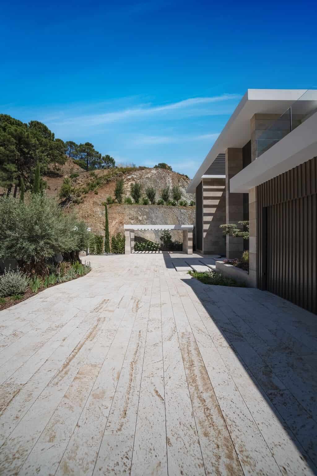 Villa Kaizen Driveway Entrance View View from the driveway up to the main entrance of Villa Kaizen nestled into hillside.