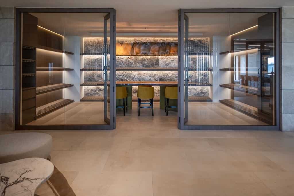 Villa Kaizen Glass Wine Cellar Stylish wine cellar enclosed in glass with dramatic lighting in Villa Kaizen.