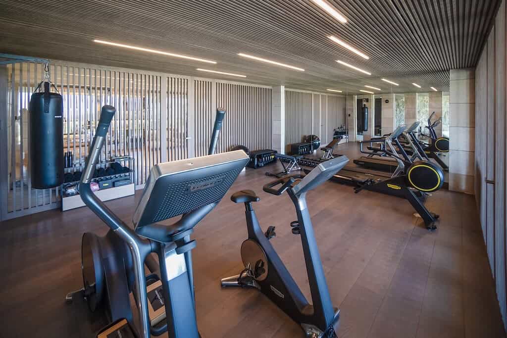 Villa Kaizen Gym Workout Room Spacious workout room in Villa Kaizen featuring treadmills, bikes, and punching bag.