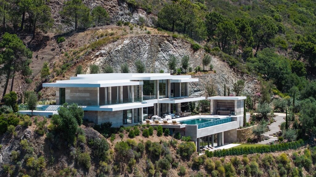 Villa Kaizen Hill Embedded Architecture Contemporary villa embedded in a rocky hillside surrounded by pine forests.