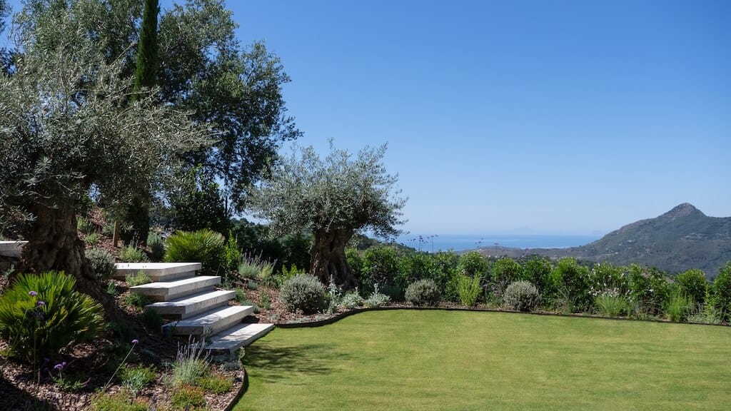 Villa Kaizen Lawn and Mountain View Lush lawn with panoramic mountain and sea views from Villa Kaizen.