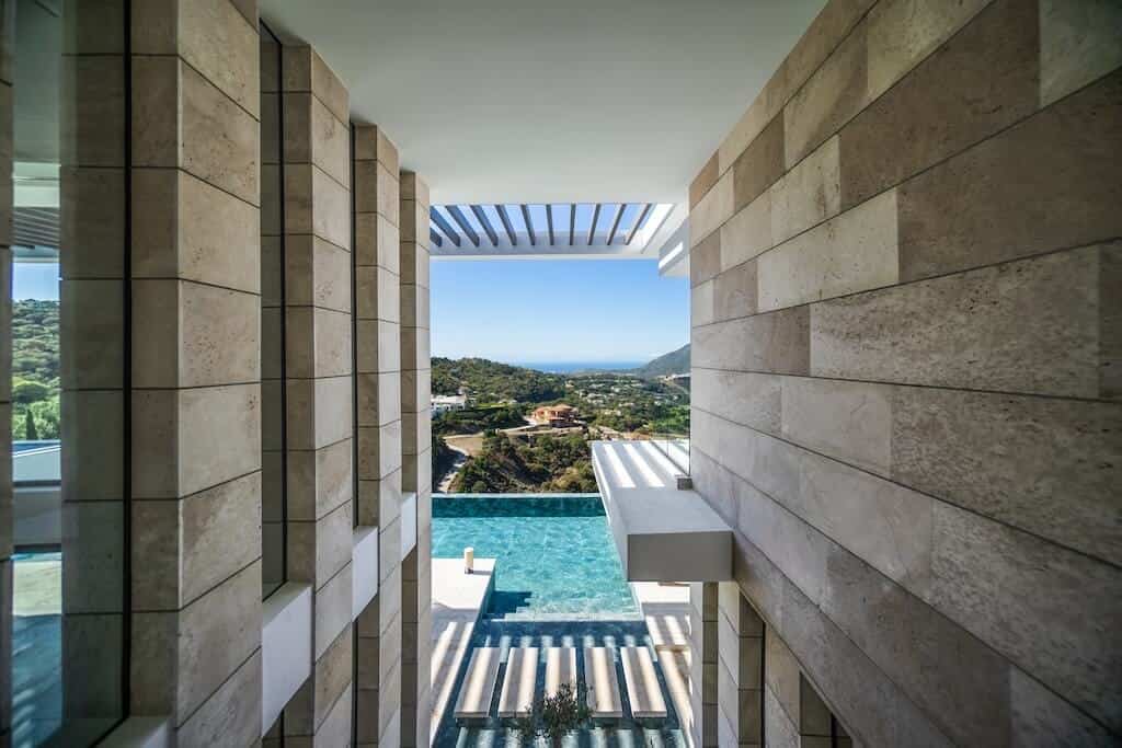 Villa Kaizen Pool Courtyard Framing Architectural framing of the infinity pool at Villa Kaizen with sea views.