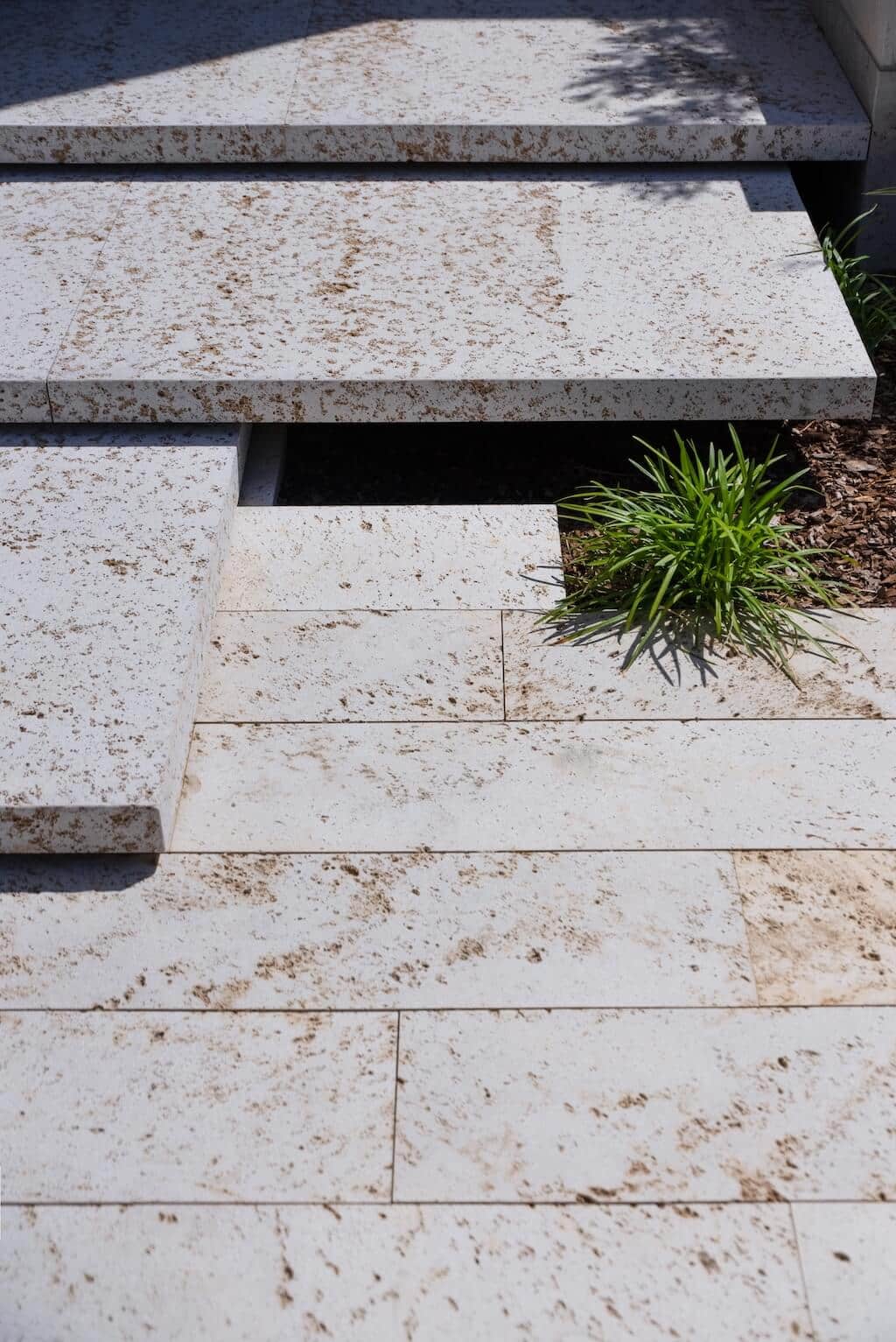 Villa Kaizen Stone Step Detail Close-up view of suspended stone stairs blending into the landscape at Villa Kaizen.