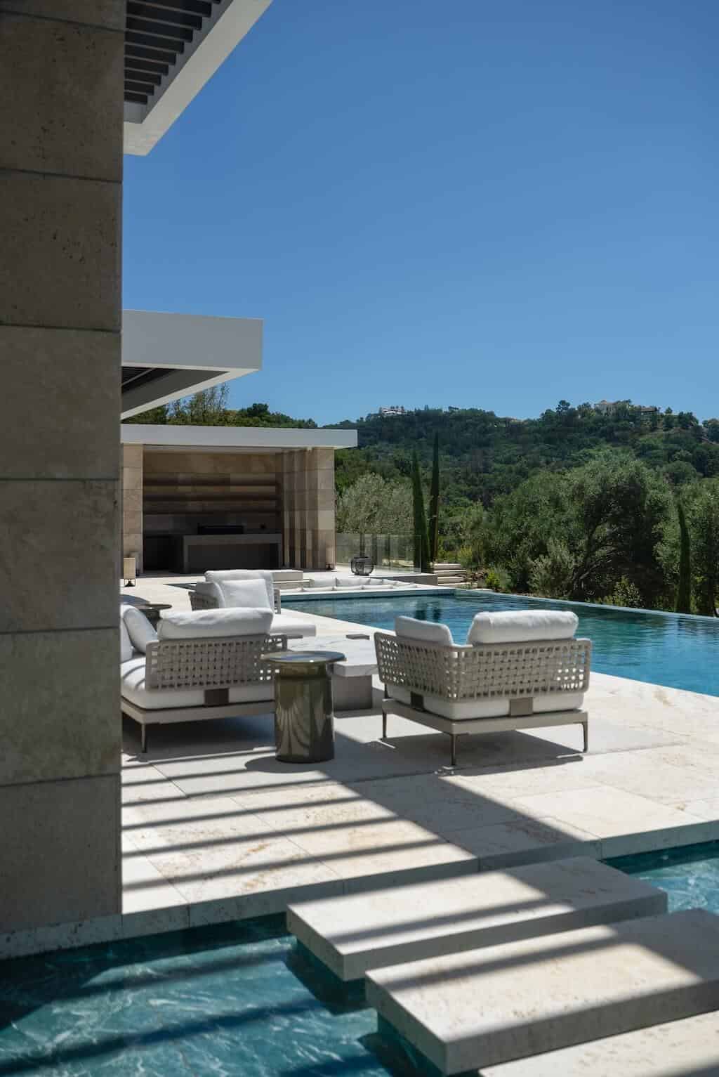 Villa Kaizen Sunken Lounge and Steps Sunken poolside lounge at Villa Kaizen with stepping stones over water.