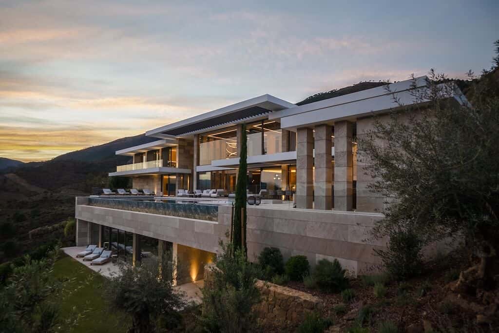 Villa Kaizen Sunset Angle Villa Kaizen viewed at sunset with its expansive pool and terraces.