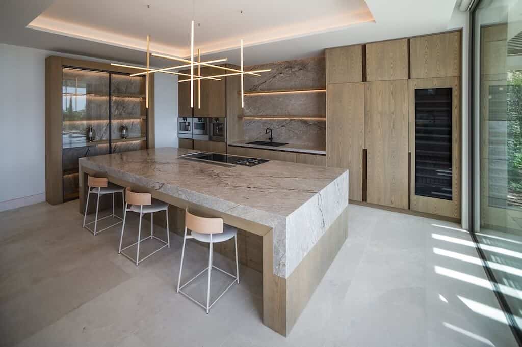 Villa Kaizen Wood Marble Kitchen Luxury kitchen with marble island and wood cabinetry in Villa Kaizen.