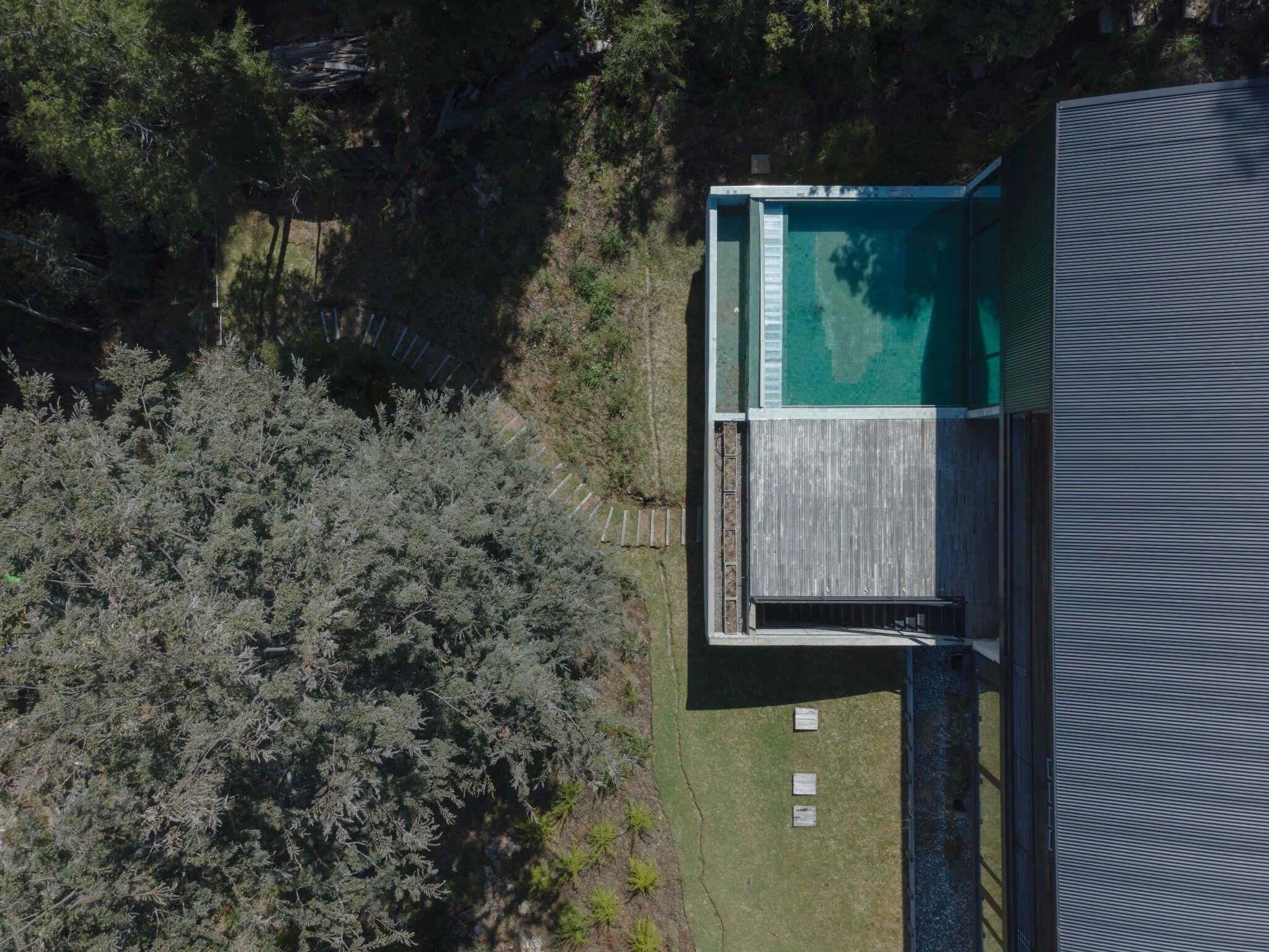 Drone aerial view of pool deck at VLA House in Patagonia.
