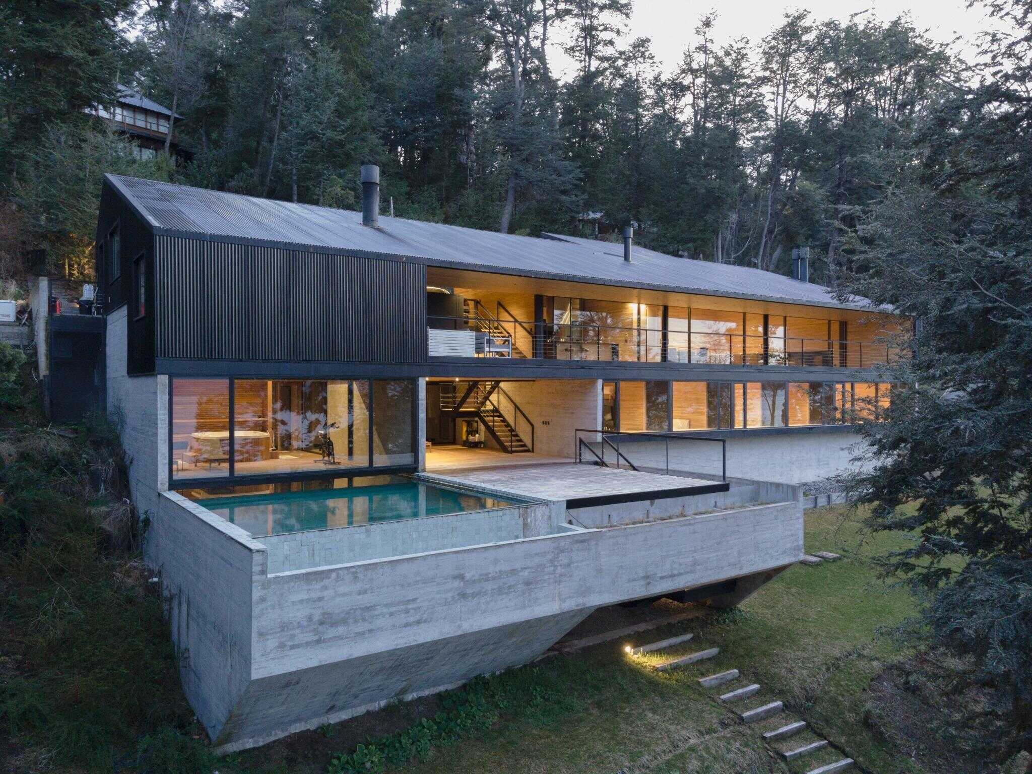 VLA House by A4estudio with concrete terrace and infinity pool.