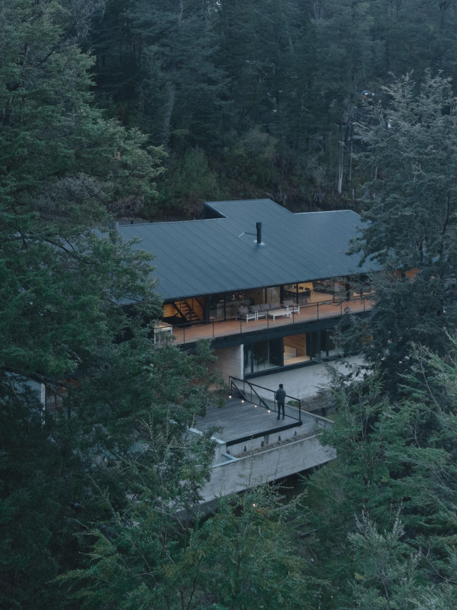 Floating balcony design of VLA House by A4estudio nestled in the forest.