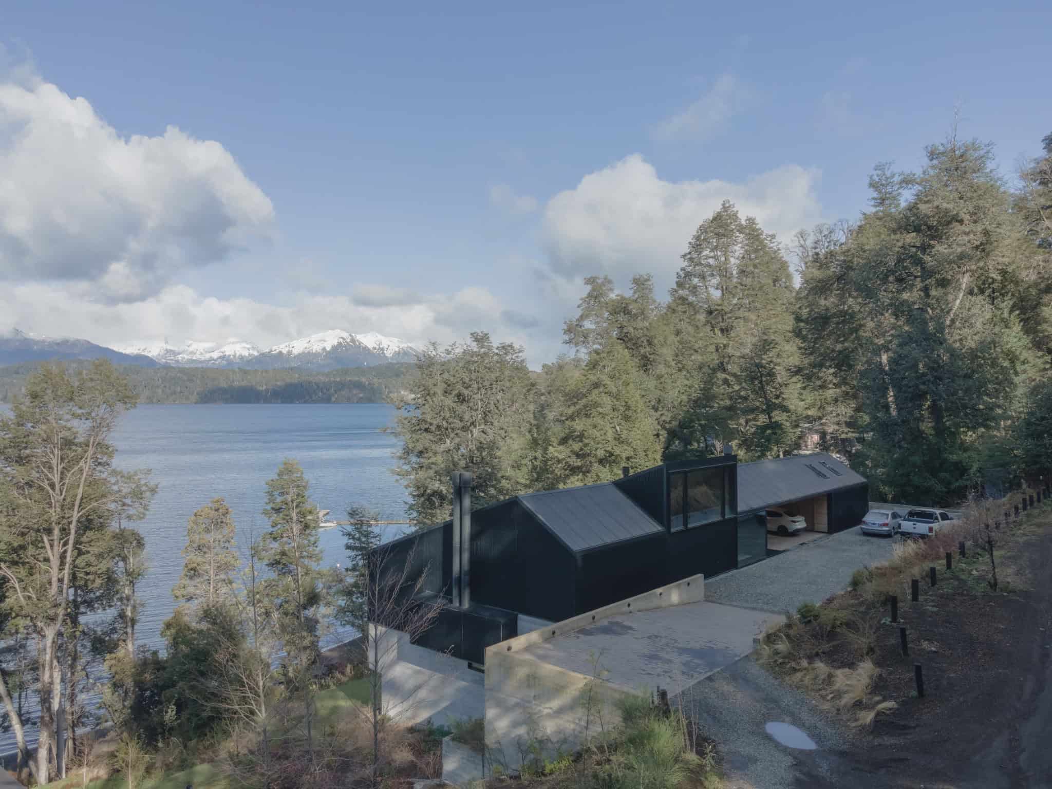 Lakeside modern architecture of VLA House nestled in Patagonian forest.