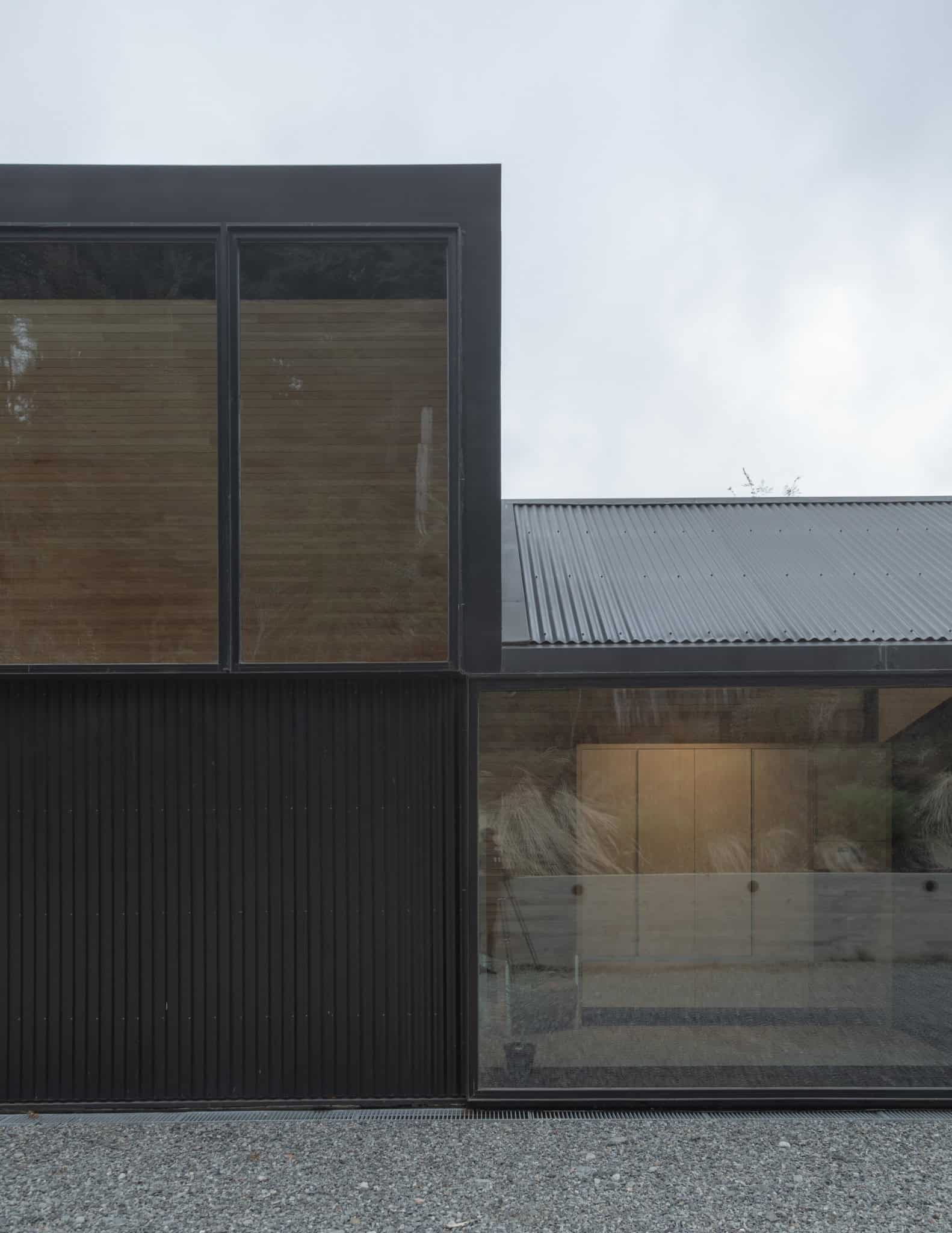 Close-up of floor-to-ceiling glass window showcasing interior plantscape.