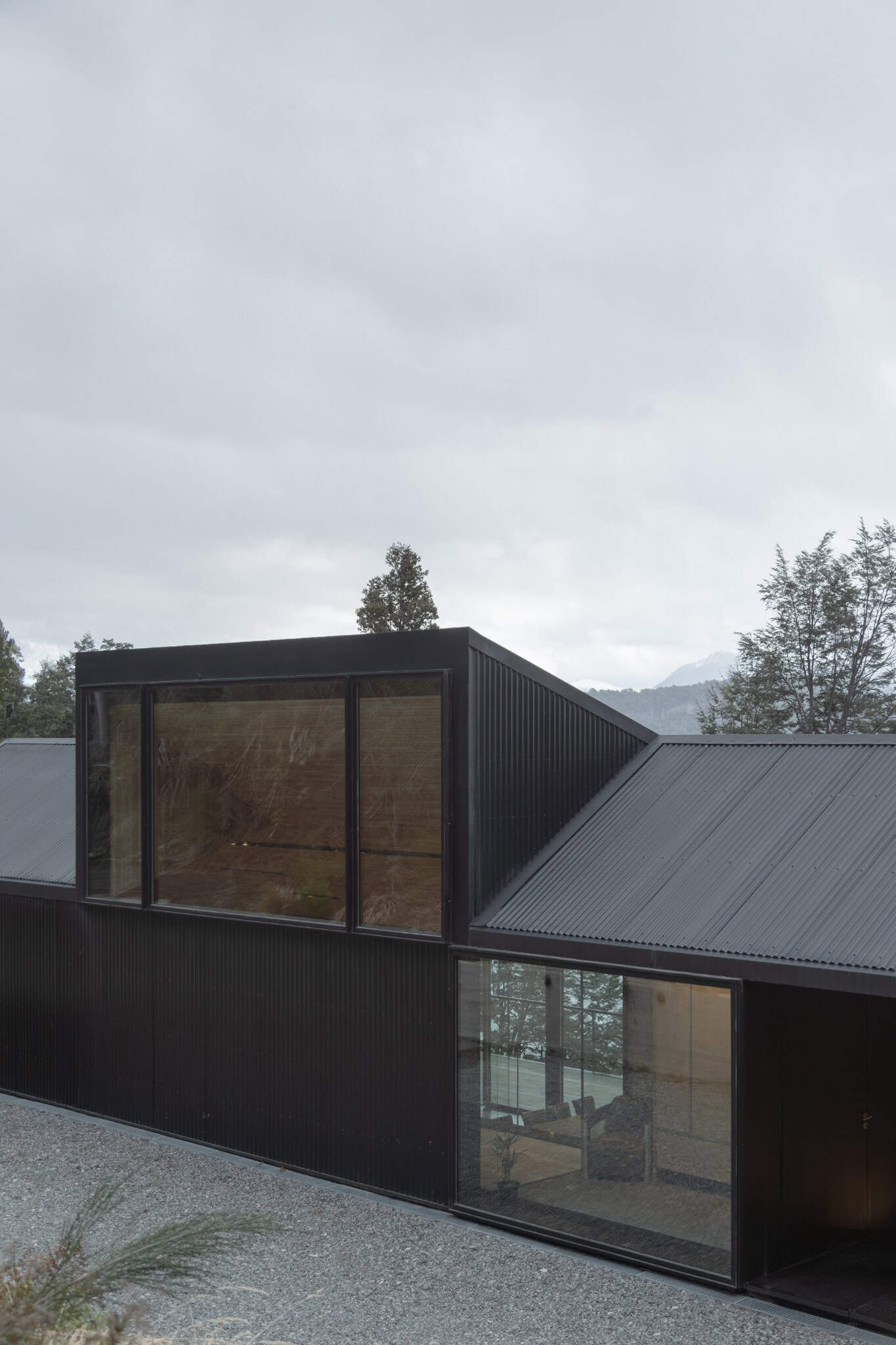 Modernist black corrugated metal siding of VLA House by A4estudio.