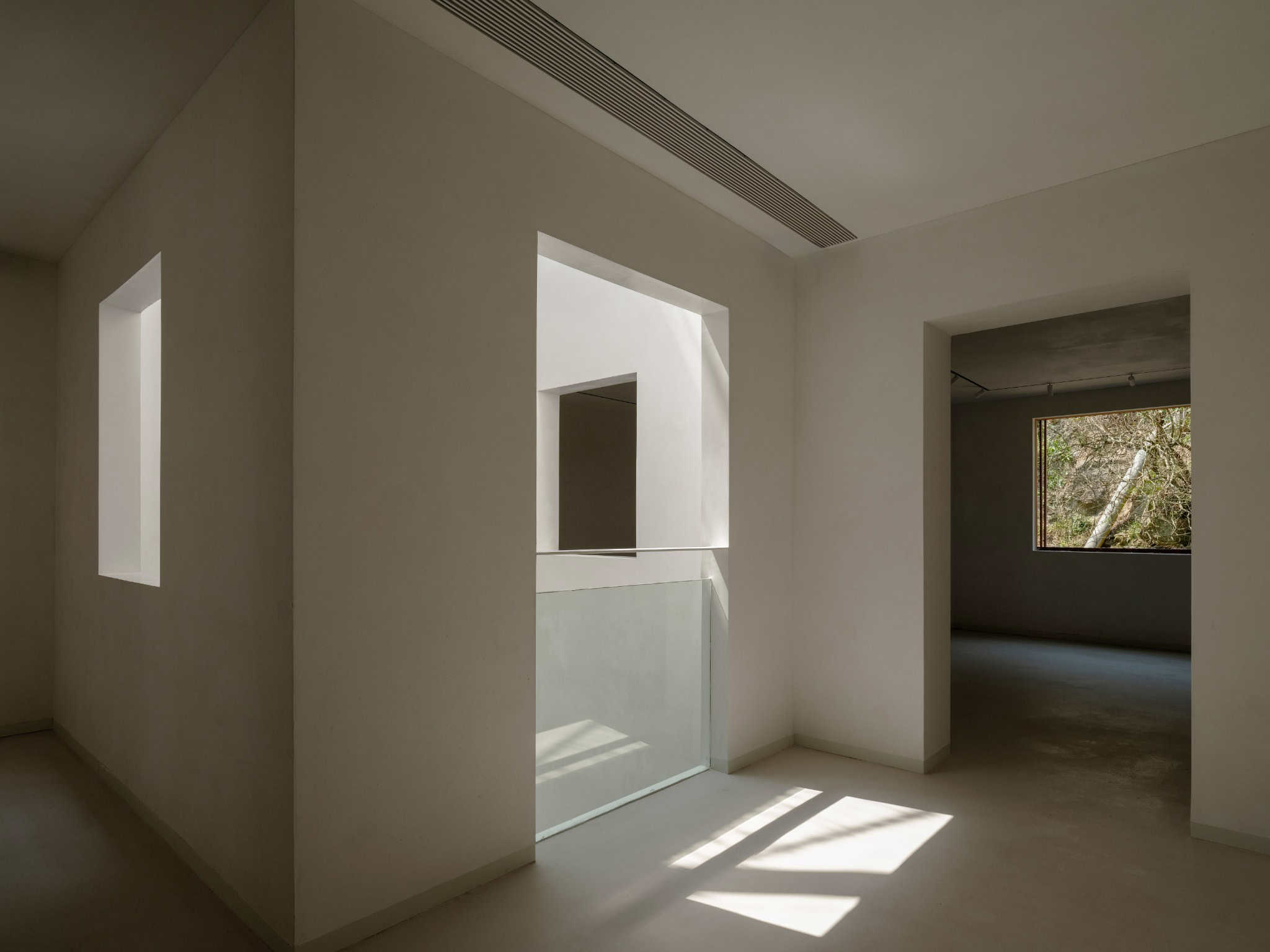 Every Room with View to Atrium Interior view showing window openings to central atrium in Z Museum