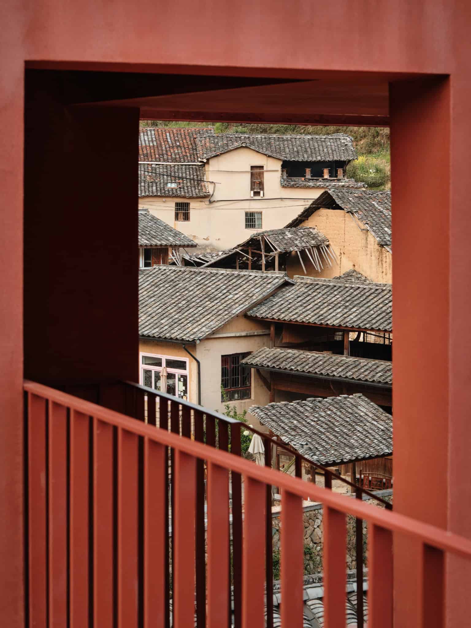 Framed View Connecting Village - Z Museum Village rooftops seen through a red architectural frame at Z Museum