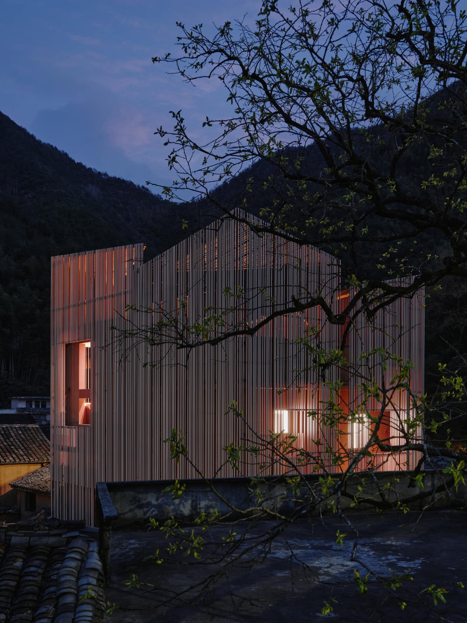 Interior Glow Without External Lighting - Z Museum Warm light glowing from inside Z Museum with no external illumination