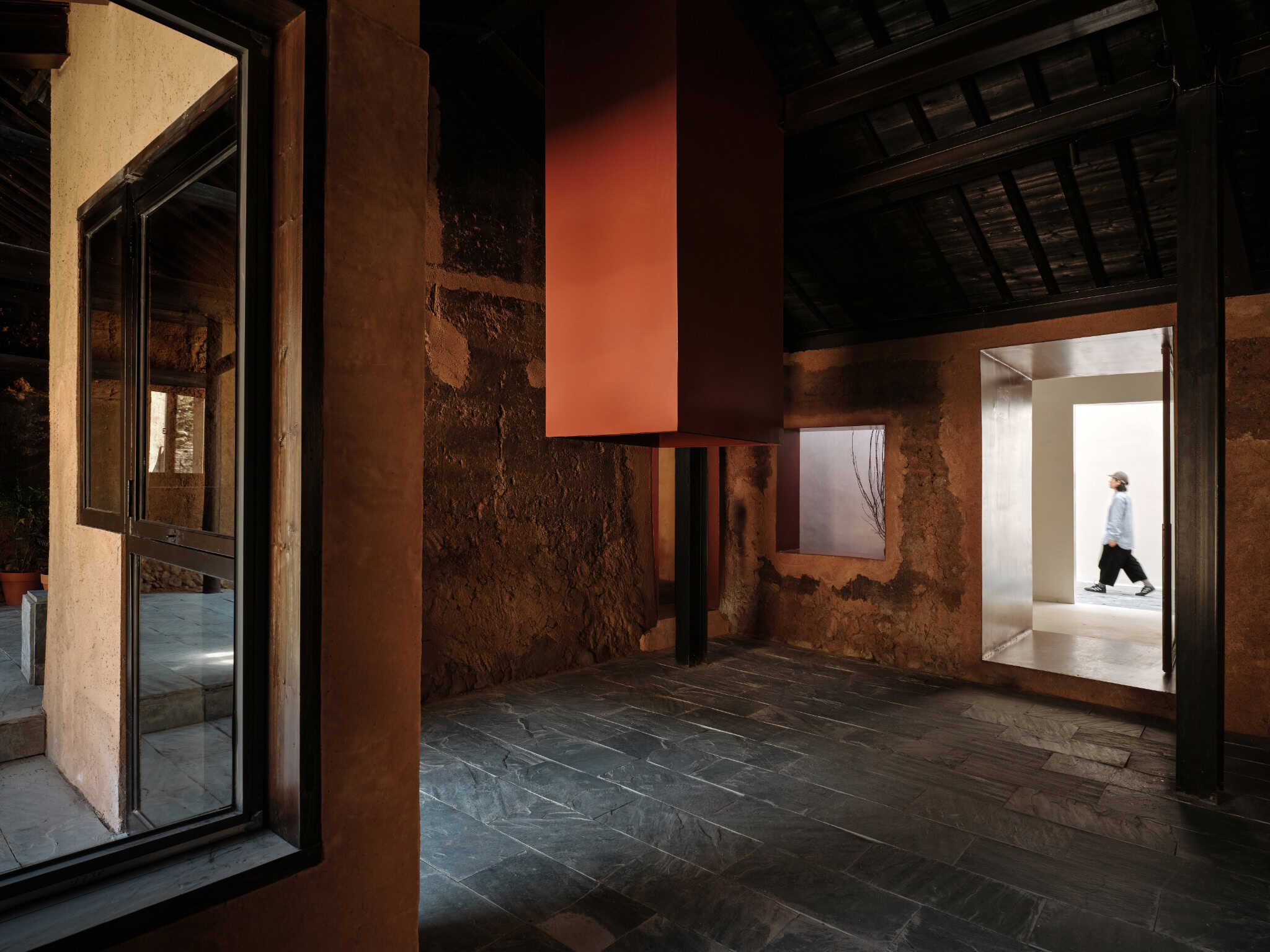 Z Museum Prelude Hall vs Bright Atrium Dark prelude hall of Z Museum opening into a bright atrium space