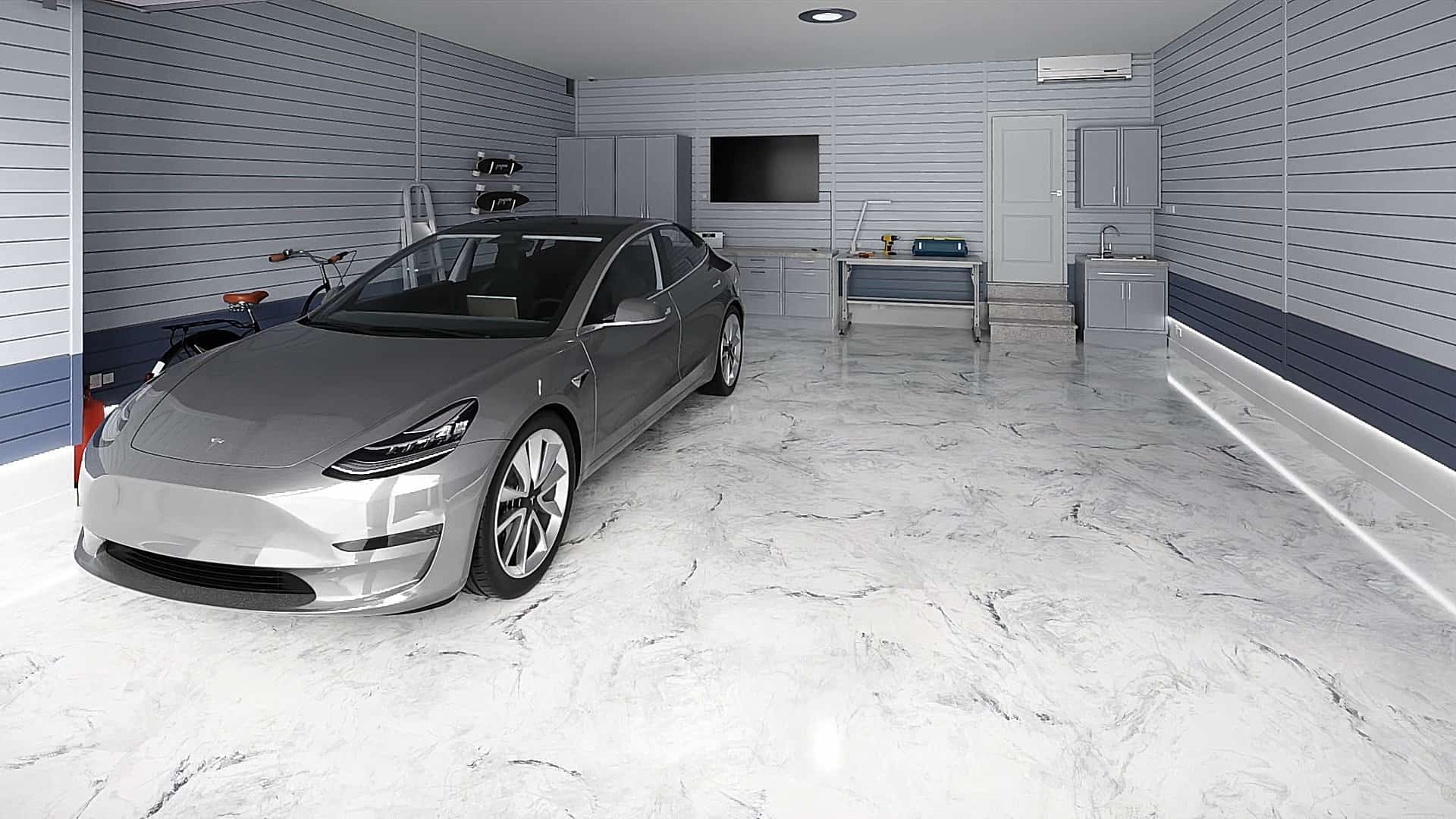 Modern luxury garage with polished epoxy marble-effect flooring and a parked Tesla Model 3.