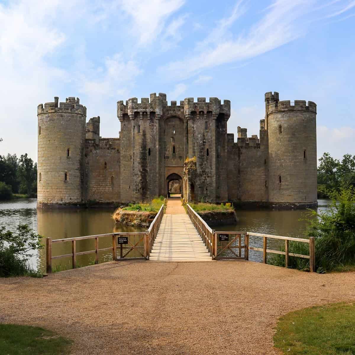 Bodiam Castle in East Sussex, England, with its moat and towers reflected in water