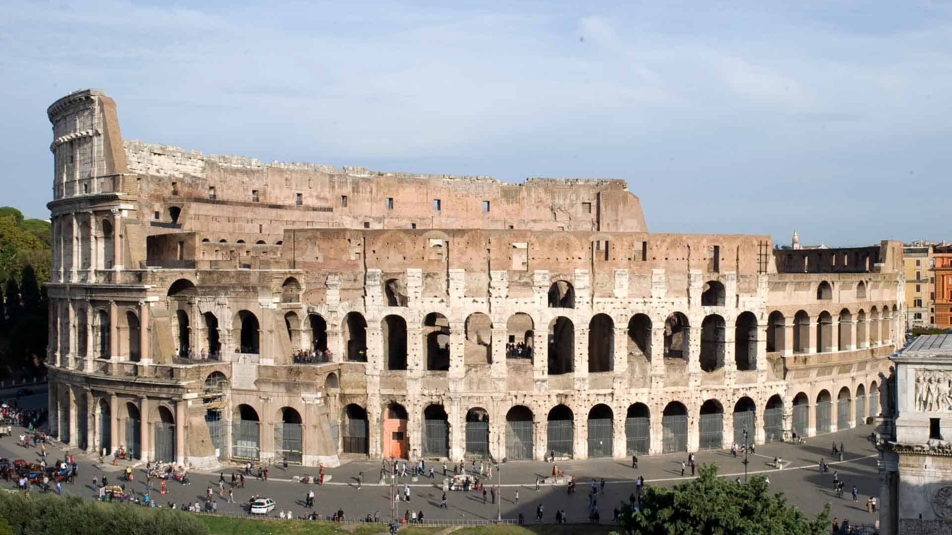 Exterior view of the Colosseum in Rome, showing its arches and elliptical shape