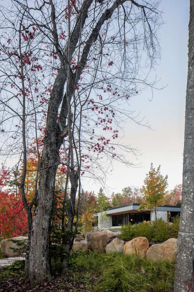 The House of la Baie de l’Ours by ACDF Architecture: A Lakeside Timber Retreat in Québec Bedroom interior of La Maison de la Baie de l’Ours with wood finishes