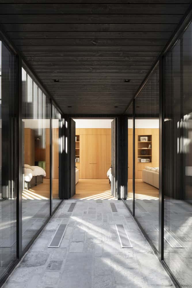 The House of la Baie de l’Ours by ACDF Architecture: A Lakeside Timber Retreat in Québec Wooden staircase detail inside La Maison de la Baie de l’Ours