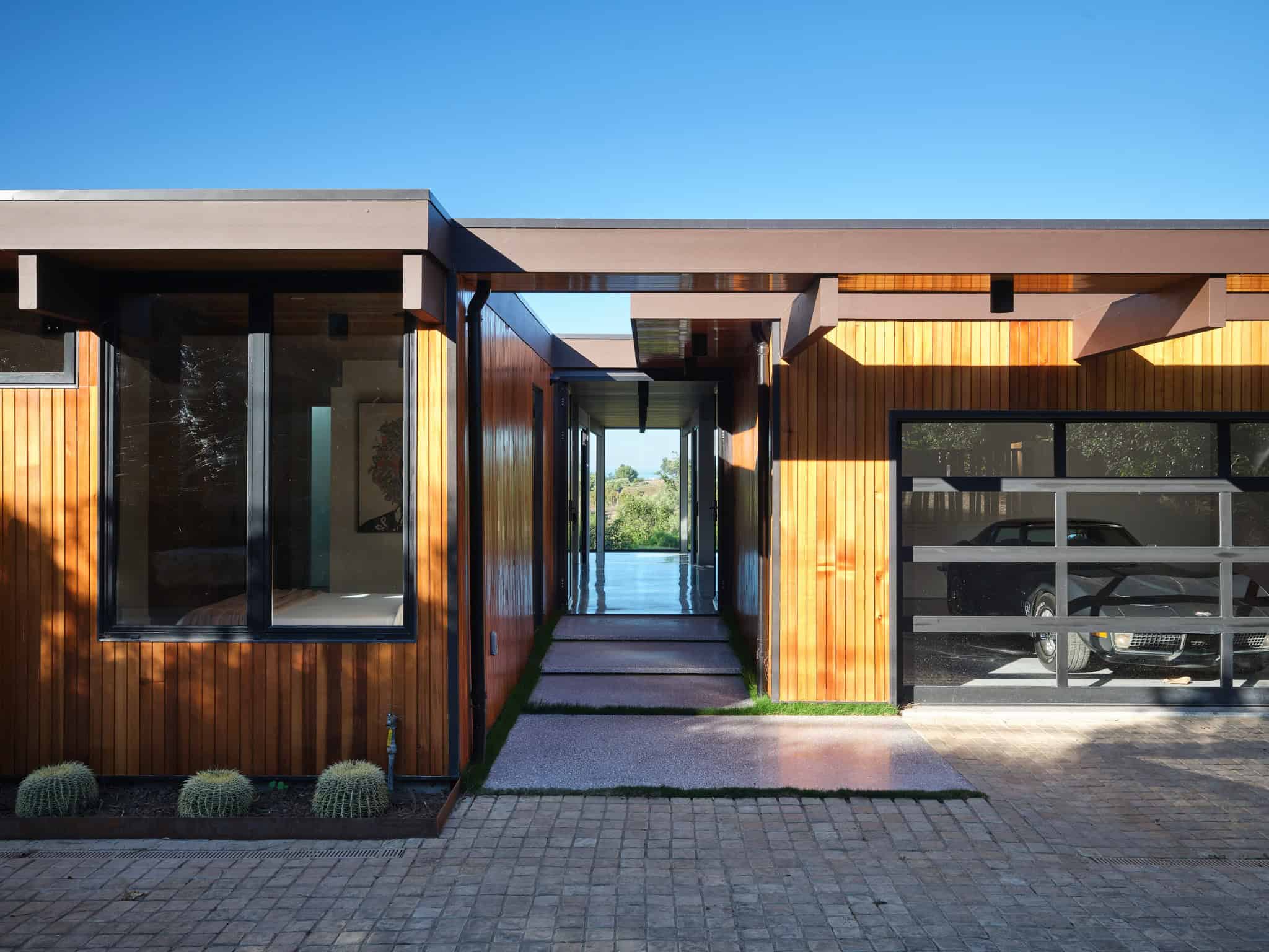 Malibu Glass Box House by Klopf Architecture – breezeway axis to garage, Malibu, California