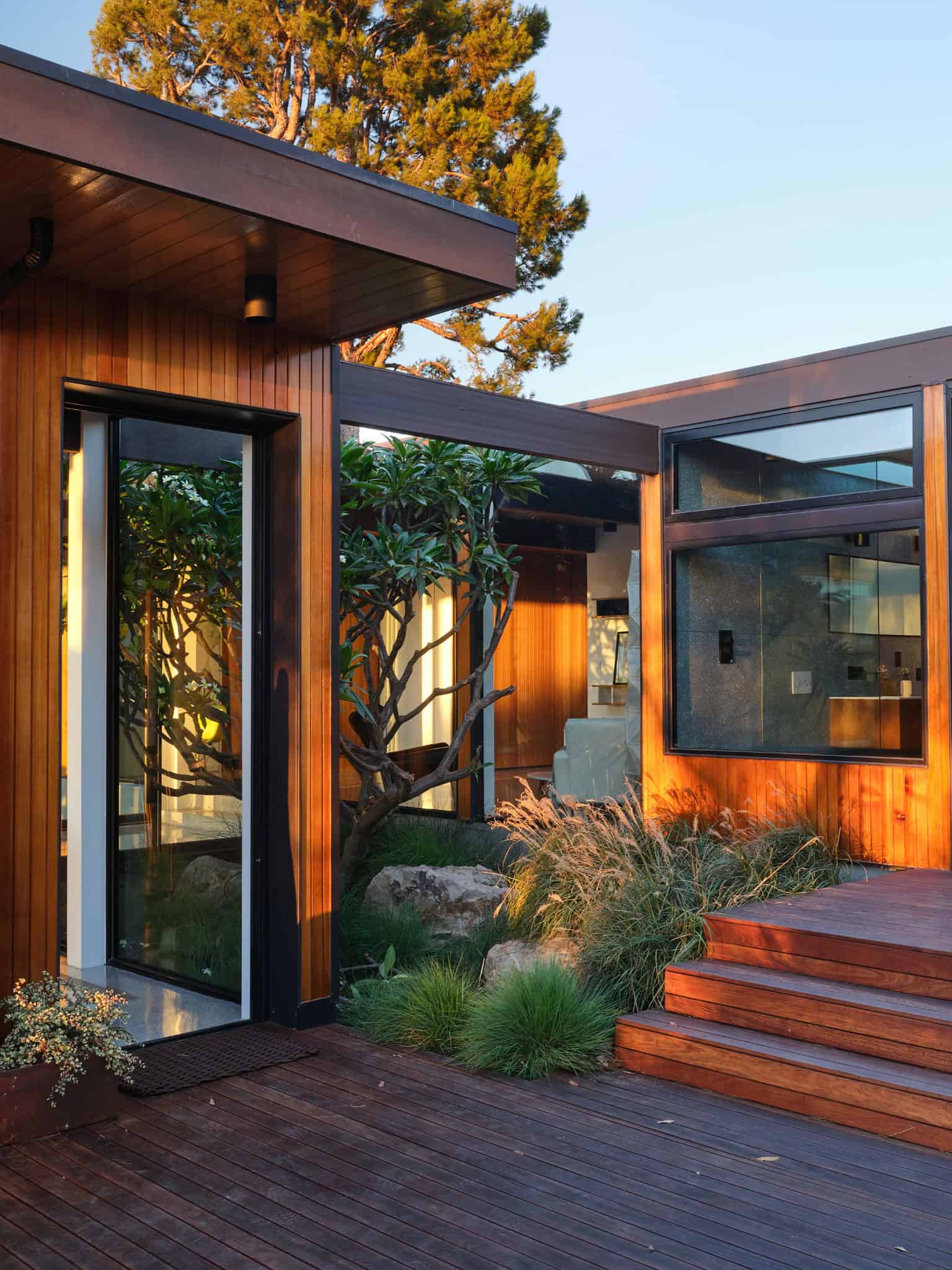 Malibu Glass Box House by Klopf Architecture – wood-clad entry courtyard, Malibu, California