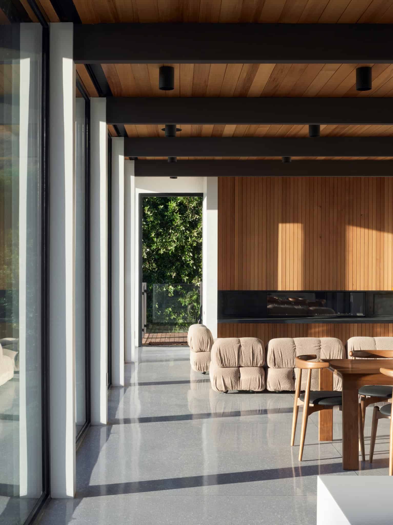 Malibu Glass Box House by Klopf Architecture – interior gallery with fireplace, Malibu, California