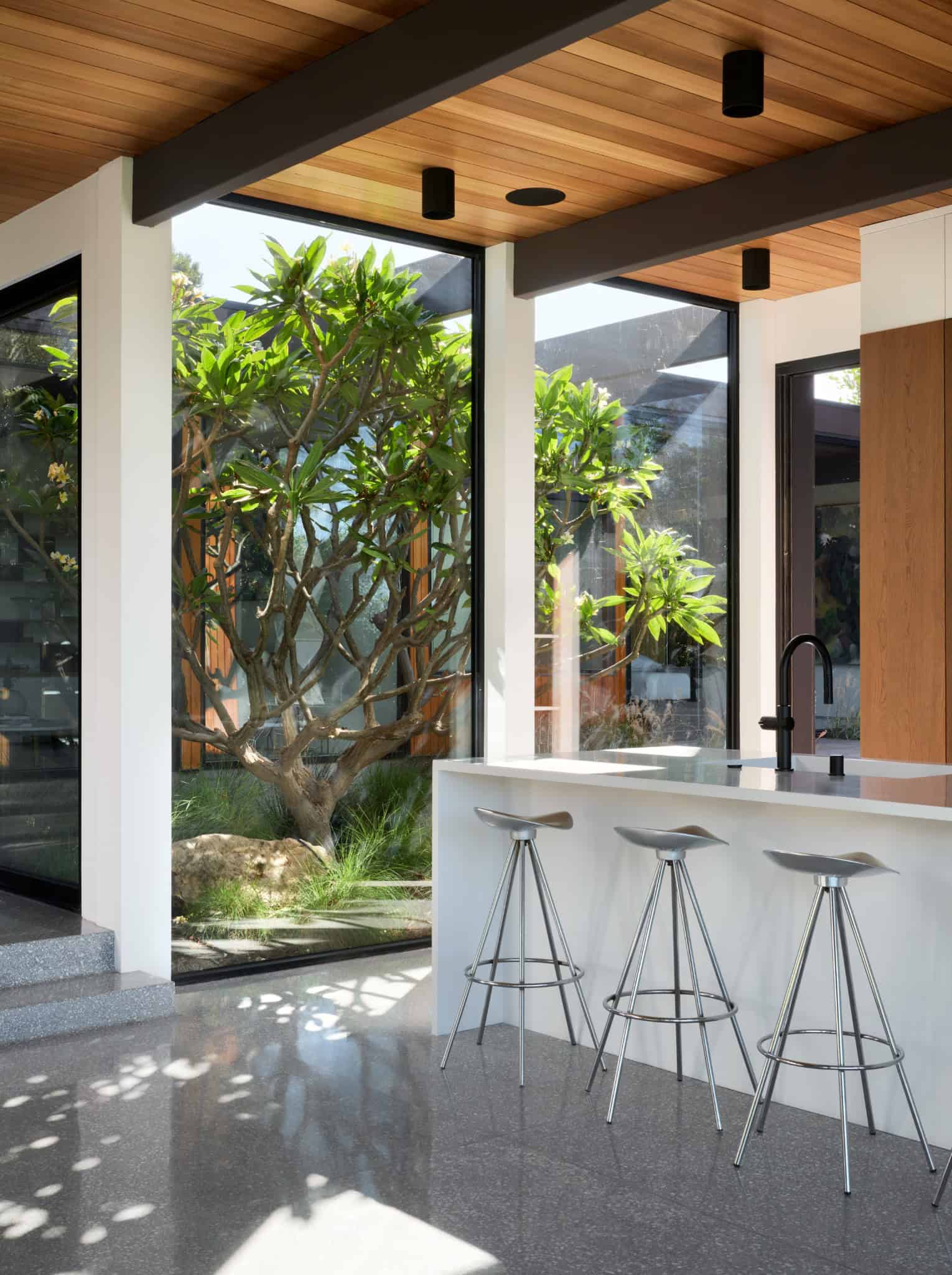 Malibu Glass Box House by Klopf Architecture – kitchen corner courtyard, Malibu, California