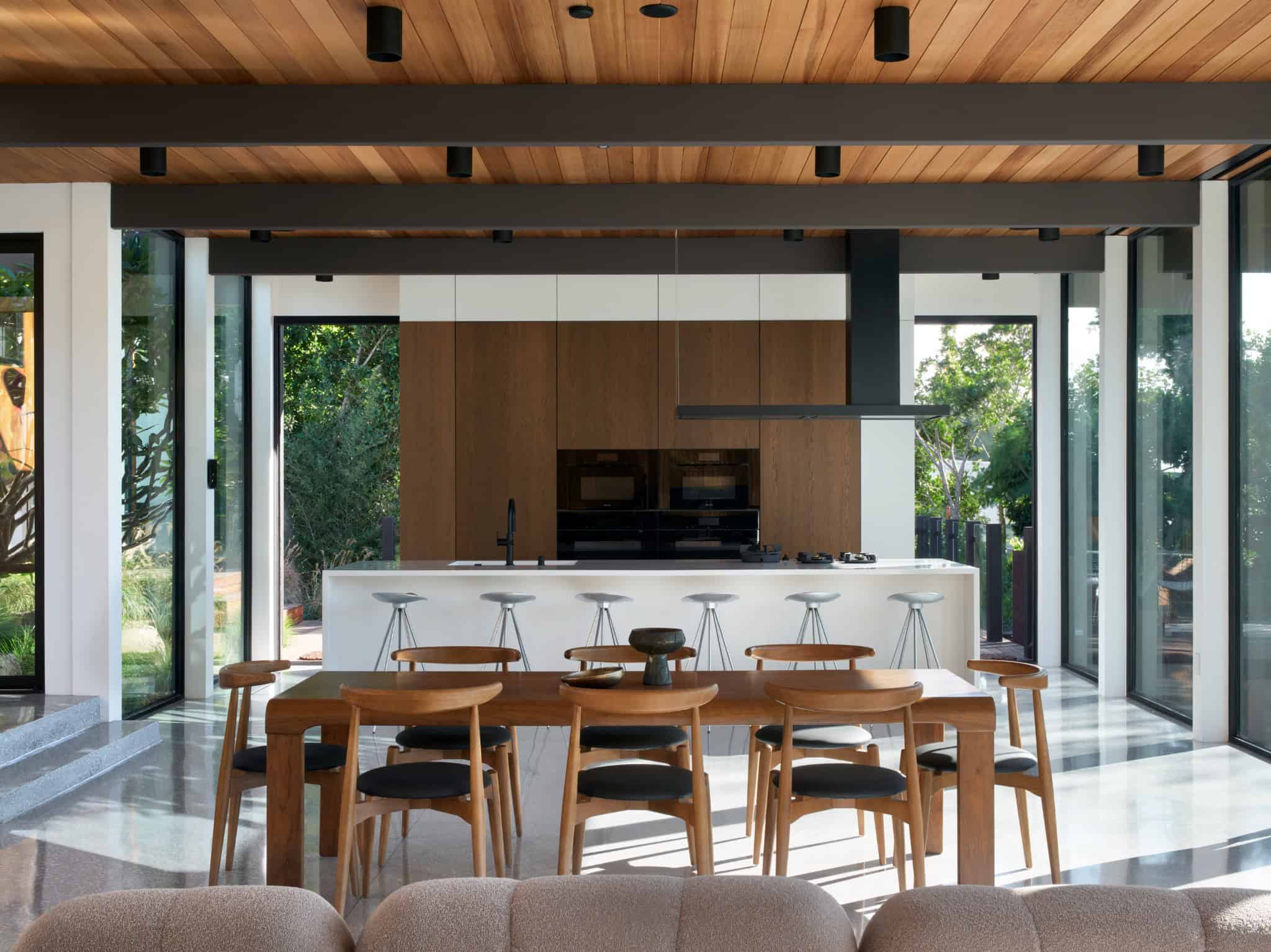 Malibu Glass Box House by Klopf Architecture – kitchen island with dining, Malibu, California