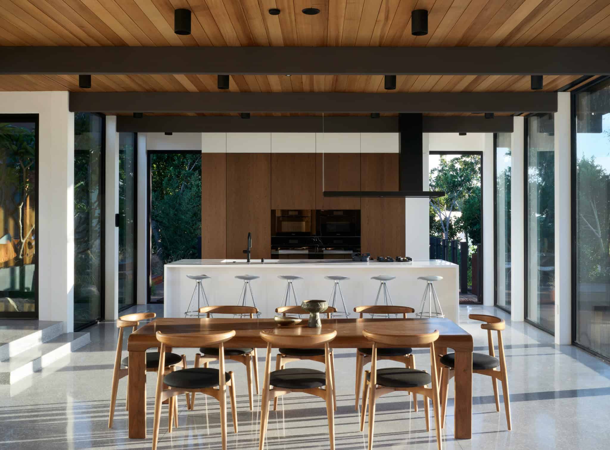 Malibu Glass Box House by Klopf Architecture – kitchen island dining overview, Malibu, California