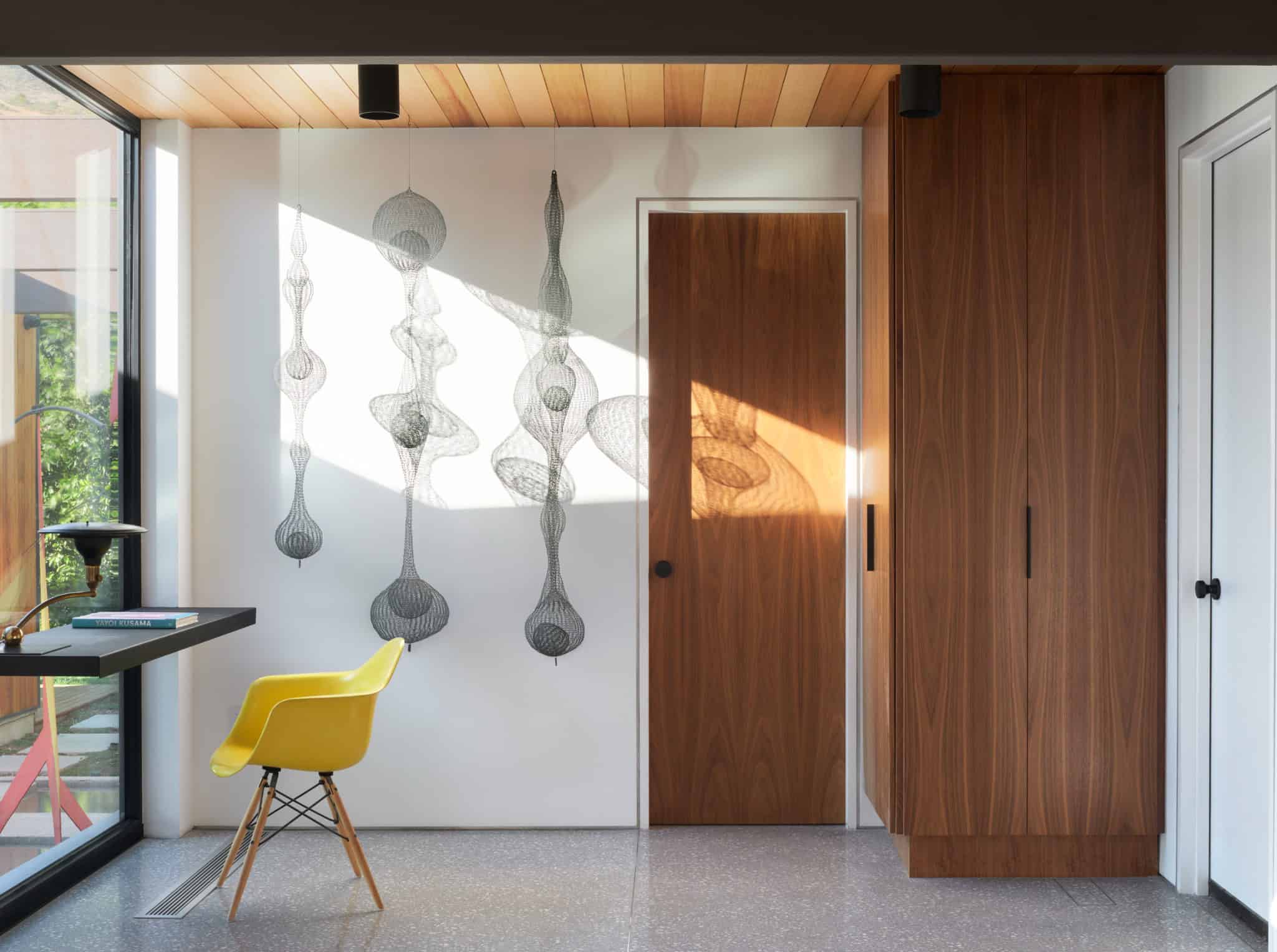 Malibu Glass Box House by Klopf Architecture – office nook with yellow chair, Malibu, California