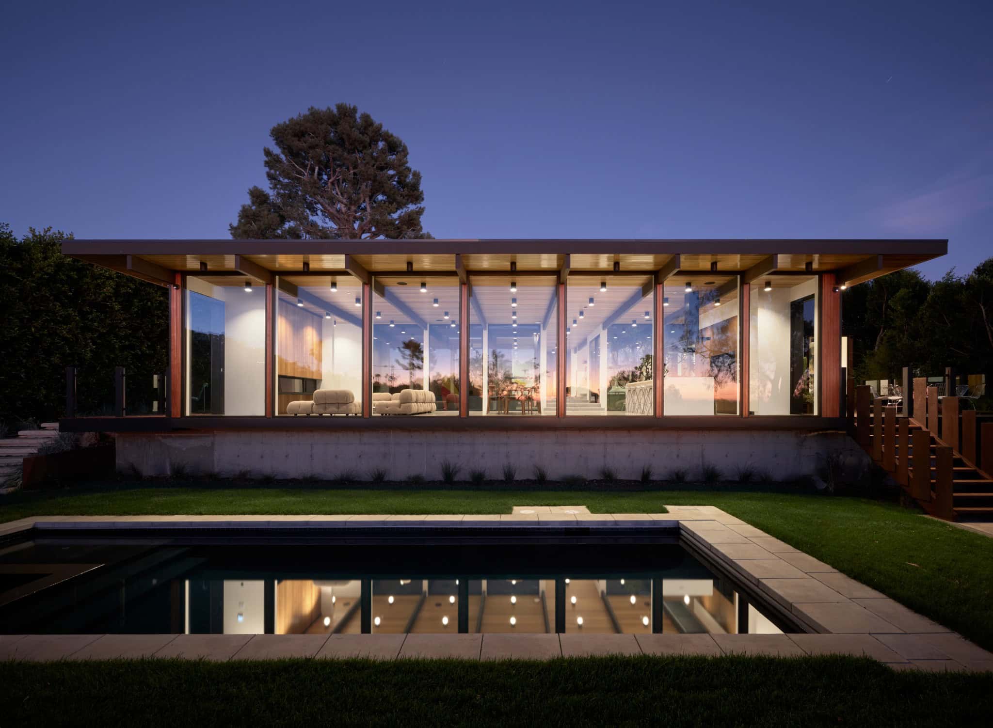 Malibu Glass Box House by Klopf Architecture – pool elevation at dusk, Malibu, California
