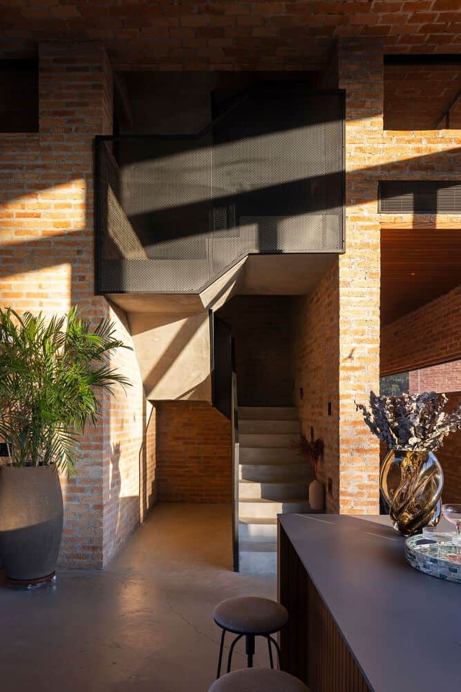Passive House Interior Stair Detail by Mareines Arquitetura Passive House interior stair with perforated metal screen, São Paulo, Brazil