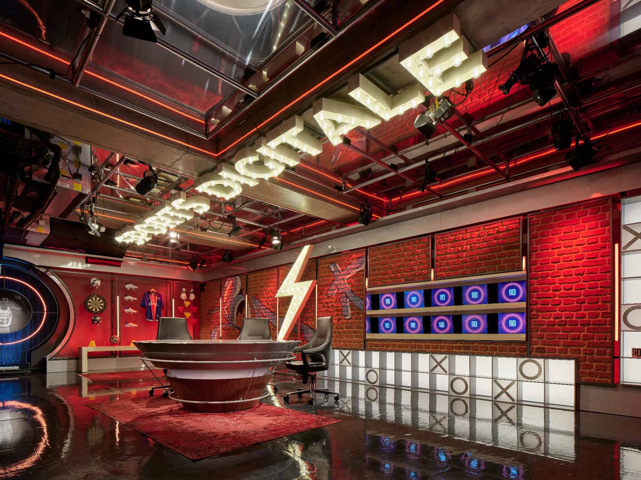 Sports Digitale YouTube Studio by BAB Architects, Istanbul – brick wall with red lighting