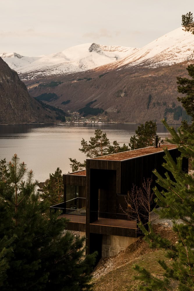 18-07 Holiday Home Hillside Long View by OFFICE INAINN 18-07 Holiday Home by OFFICE INAINN, long view on steep Norwegian hillside