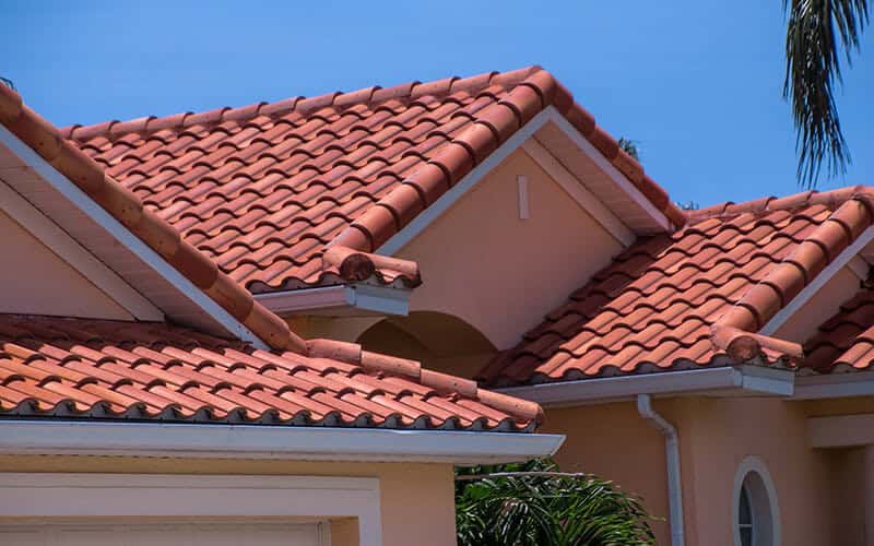 Mediterranean house with curved clay roof tiles—heat-resistant and durable roofing for warm climates