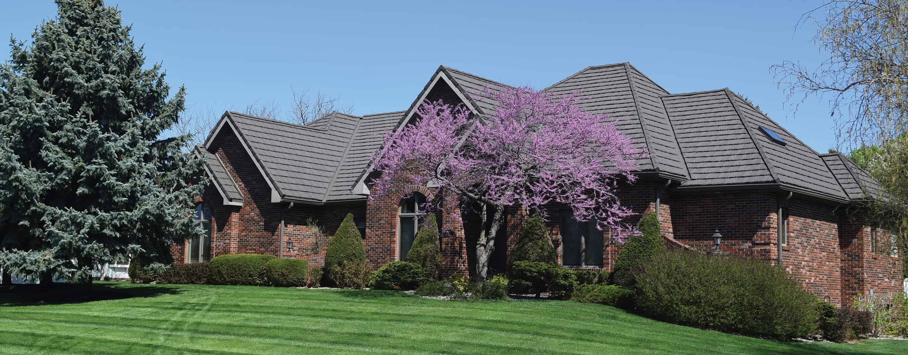 Modern house with composite synthetic roof—lightweight, durable roofing that mimics slate and cedar textures