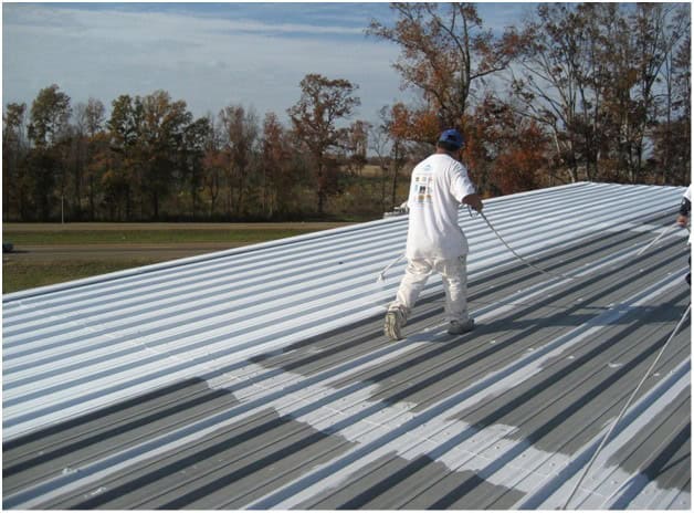 Flat building roof with reflective cool roof coating—energy-efficient white roofing designed for hot climates