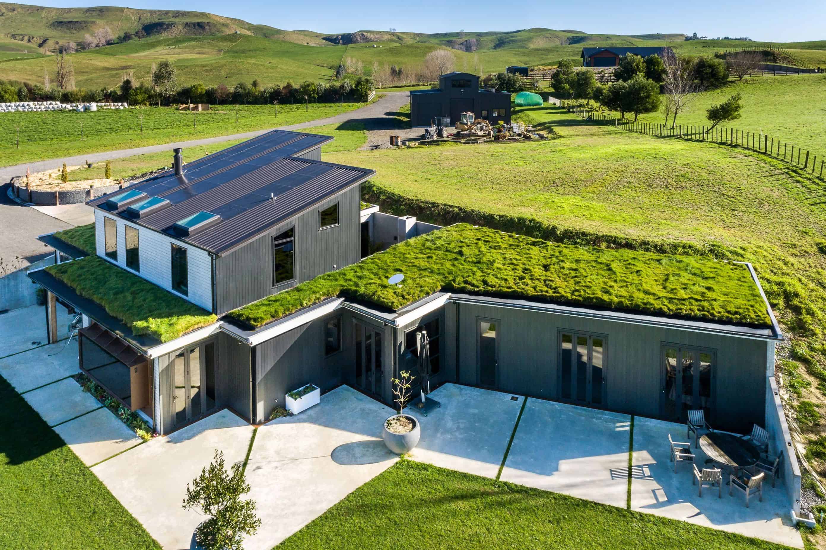 Modern building with green roof system—lush vegetation covering sustainable rooftop garden design