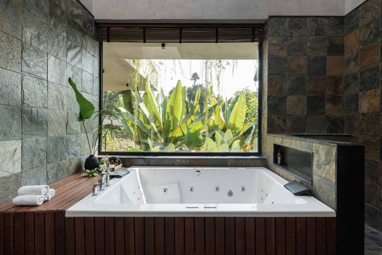 Antriya House Bathroom Spa Tub Garden View by 23 Degrees Design Shift Antriya House by 23 Degrees Design Shift — bathroom with spa tub and garden view, Hyderabad, India
