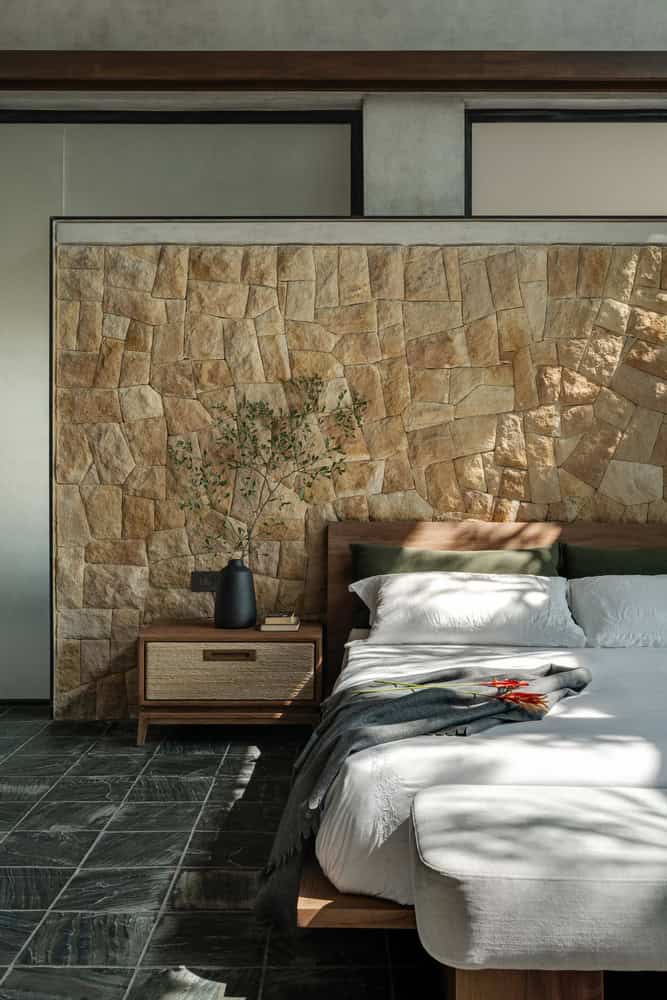 Antriya House Bedroom Detail by 23 Degrees Design Shift Antriya House by 23 Degrees Design Shift — bedroom with stone headboard detail, Hyderabad, India