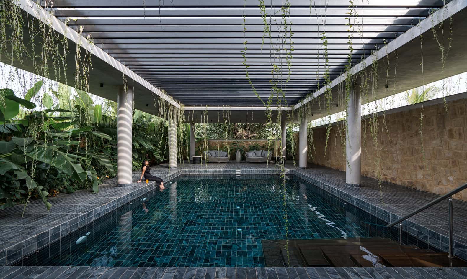 Antriya House Covered Pool with Pergola & Vines by 23 Degrees Design Shift Antriya House by 23 Degrees Design Shift — covered pool beneath pergola with hanging vines, Hyderabad, India