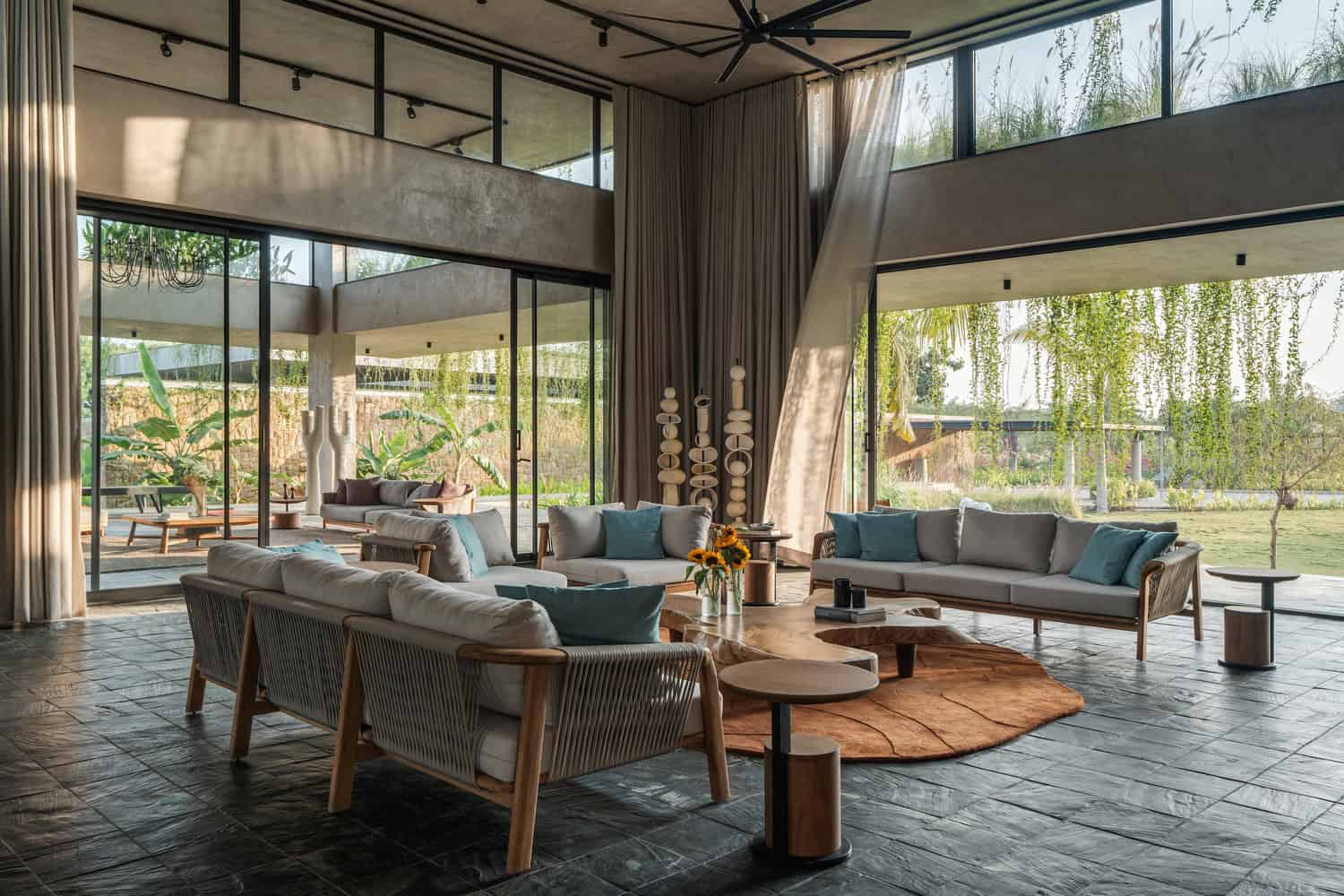 Antriya House Double-Height Living Lounge by 23 Degrees Design Shift Antriya House by 23 Degrees Design Shift — double-height living lounge with garden views, Hyderabad, India